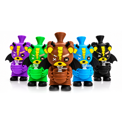 Five cartoon-style smoking accessories shaped like bear-like characters in purple, green, brown, blue, and black, each holding a small glass, arranged on a white studio background.
